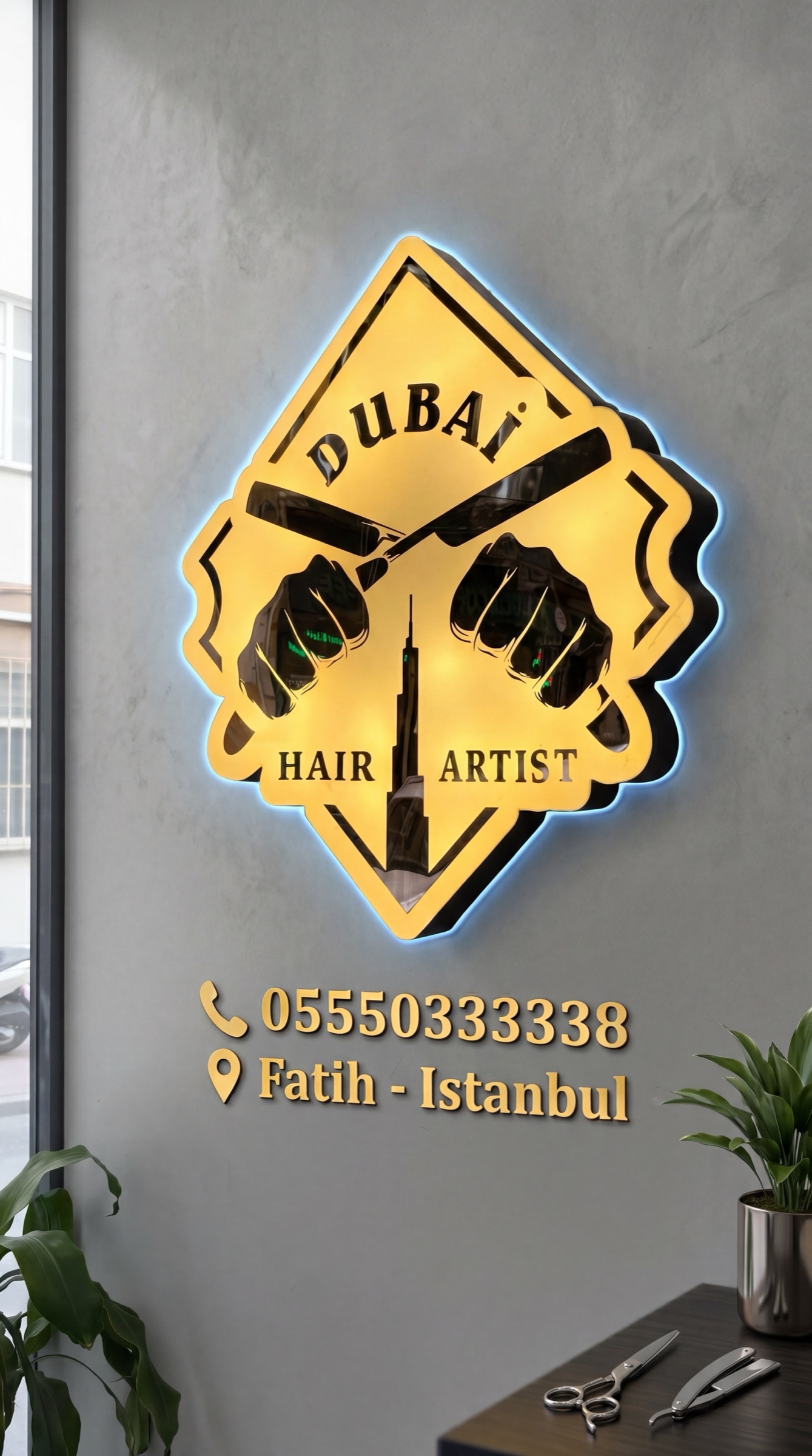 Dubai Hair Artist wall sign with phone number and Fatih Istanbul location